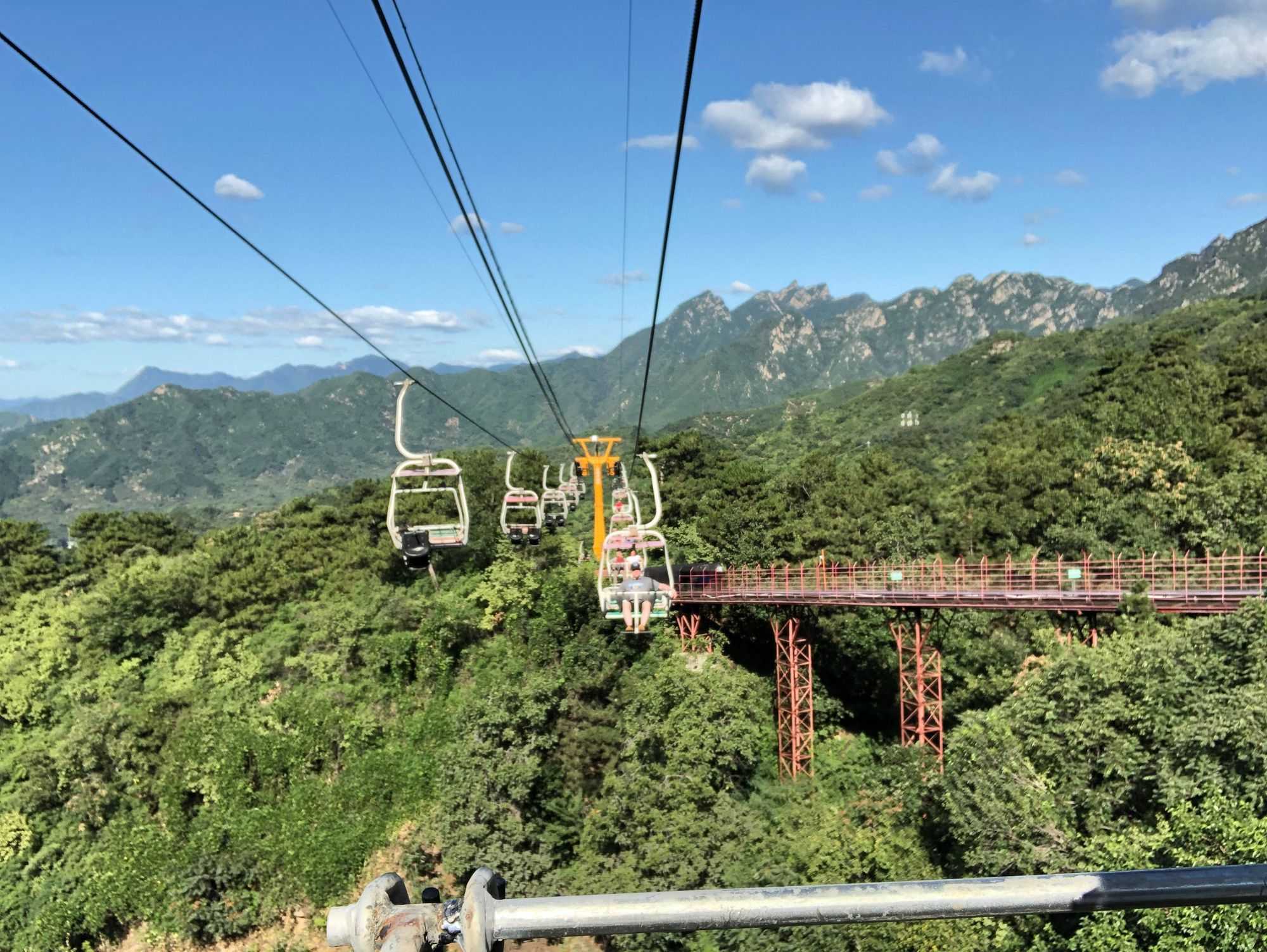 Chair lift. You can actually see a section of the tobogganing track (the red metal structure) (Image by author)